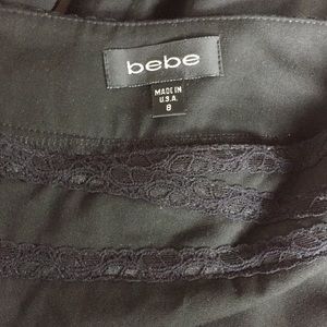 Bebe wide leg low waisted classic black trousers.